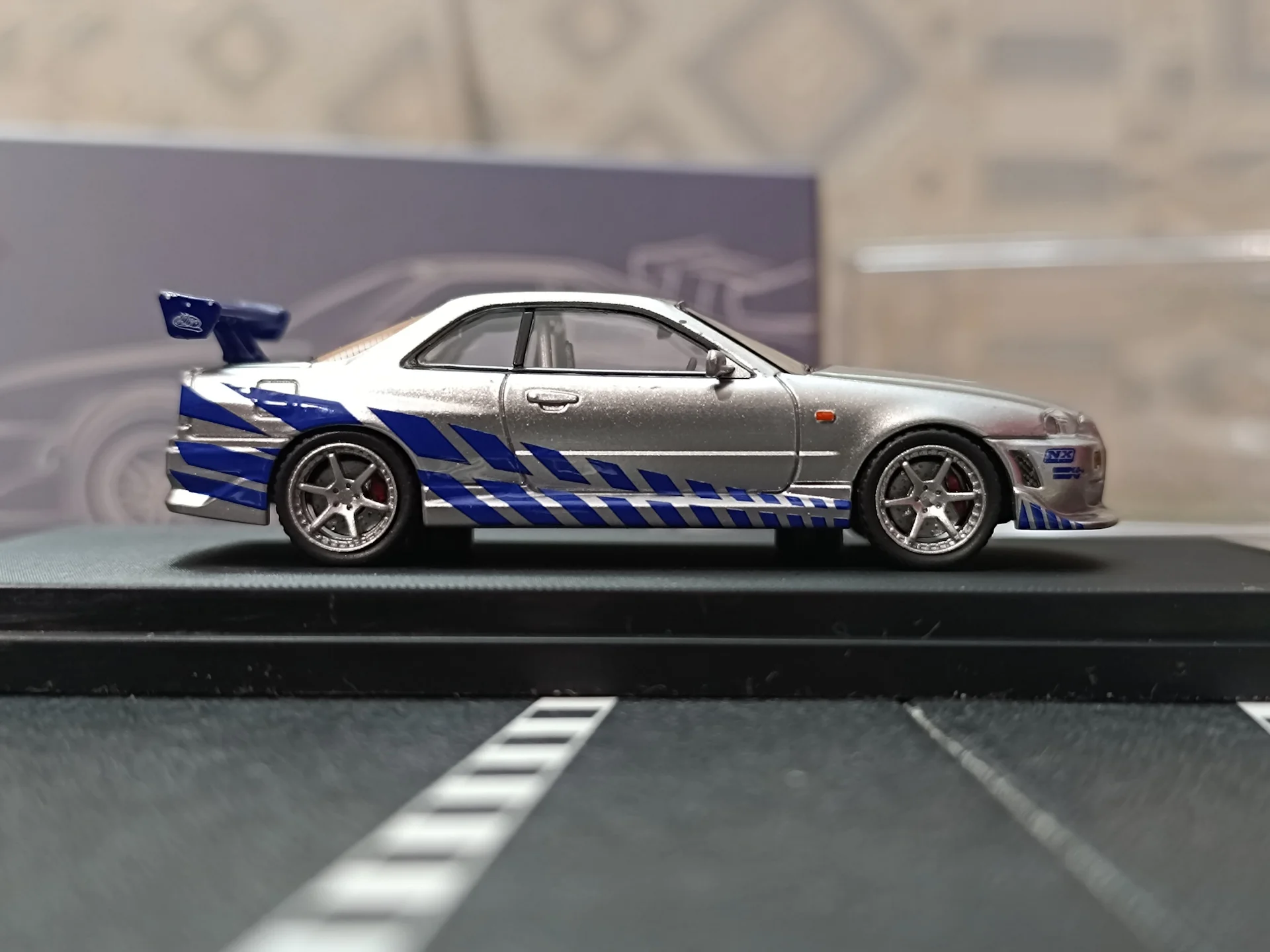 Nissan Skyline GT-R R34 C-West Imported 1:64 Scale - Image 4