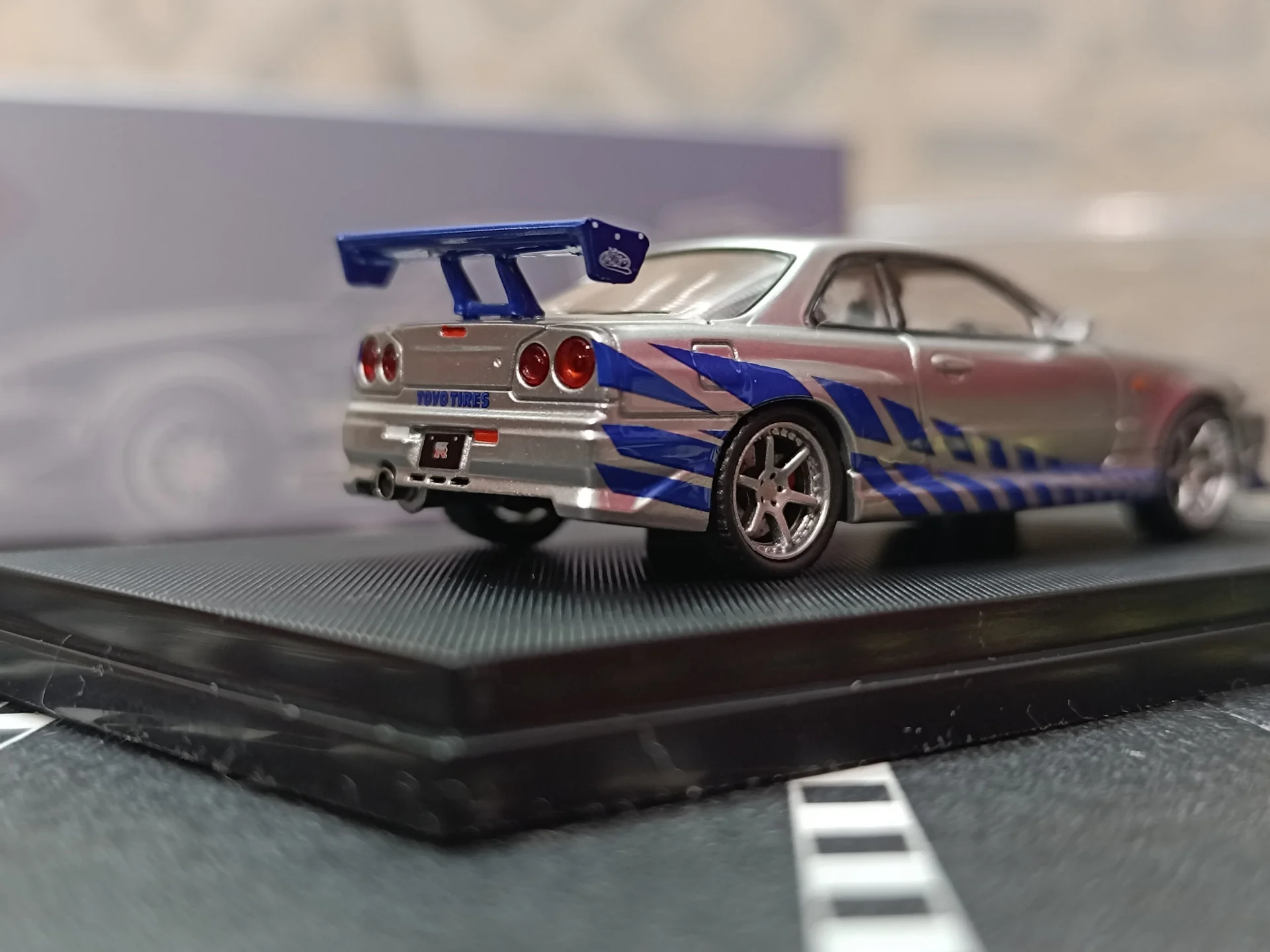 Nissan Skyline GT-R R34 C-West Imported 1:64 Scale - Image 6
