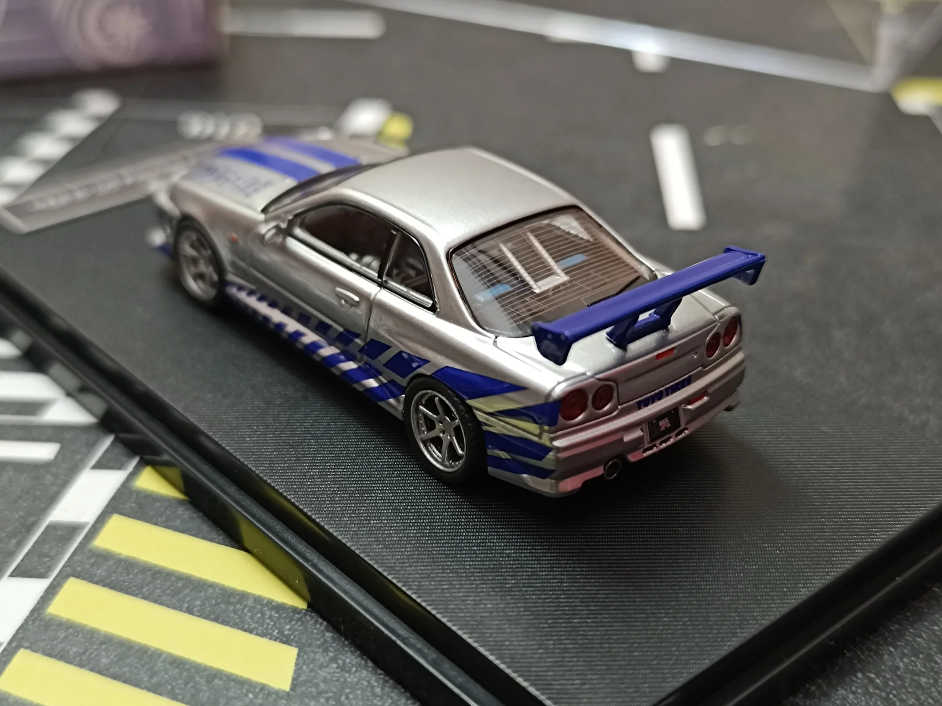 Nissan Skyline GT-R R34 C-West Imported 1:64 Scale - Image 7