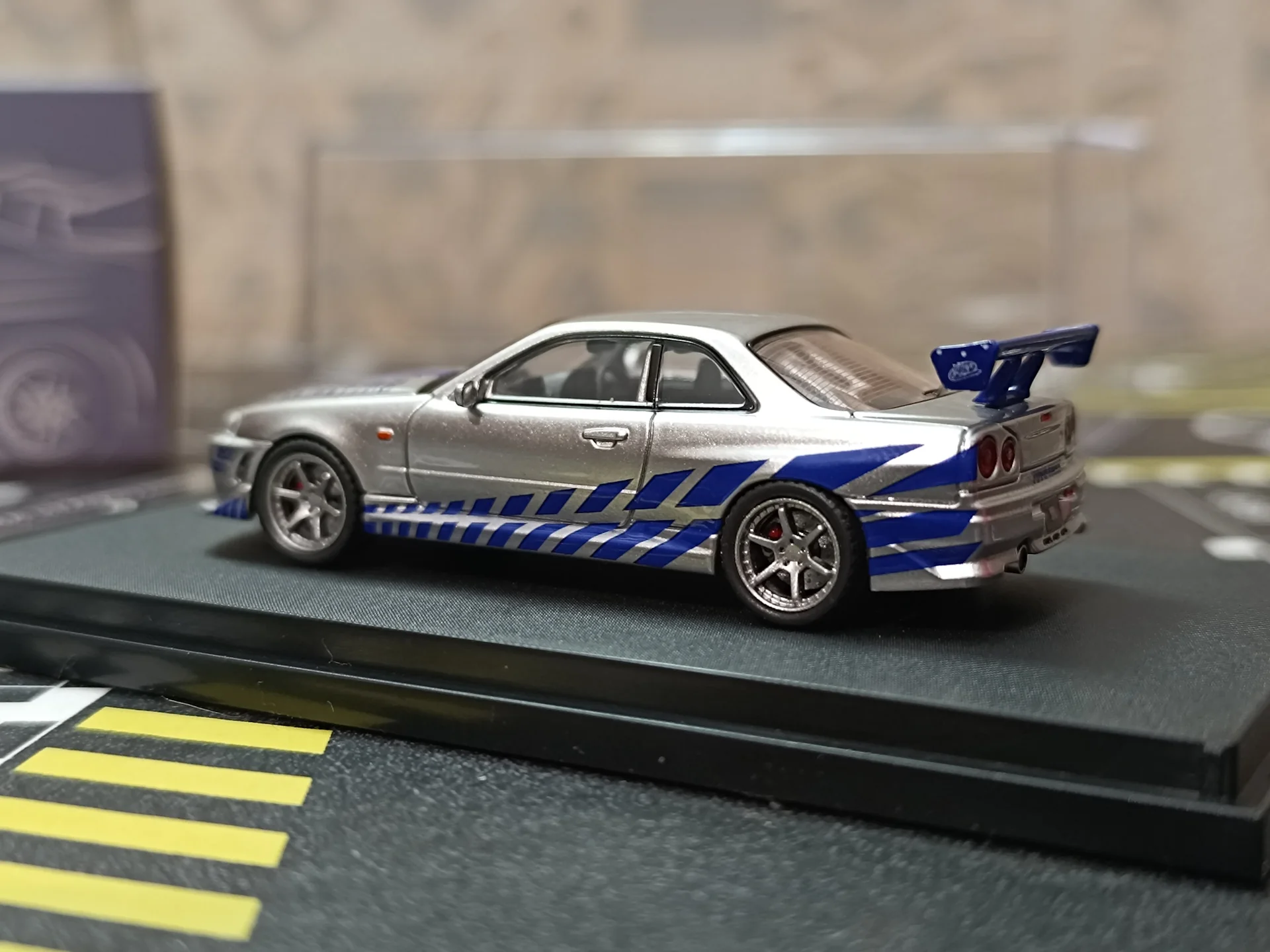 Nissan Skyline GT-R R34 C-West Imported 1:64 Scale - Image 8